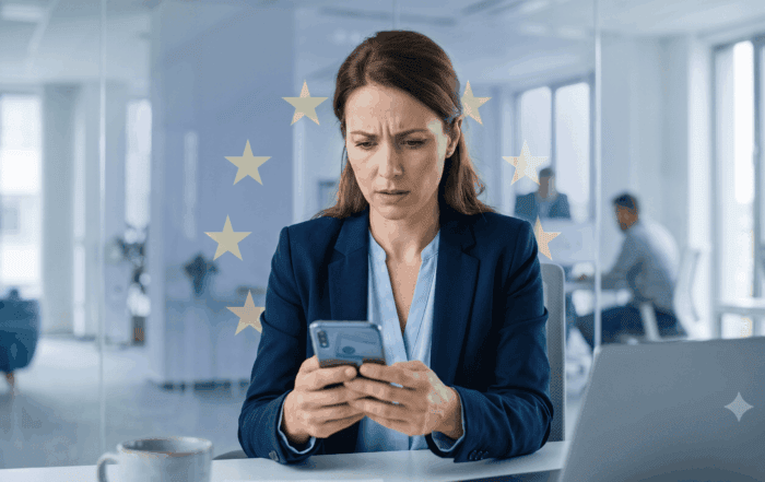 Persona revisando su teléfono móvil con preocupación tras ser víctima de phishing bancario, con símbolo de la Unión Europea de fondo representando la protección europea al consumidor